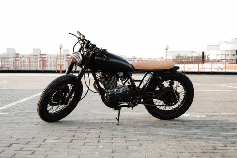 motorbike. road and city with open sky on background